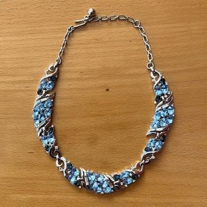 A beautiful Trifari silver with blue and sparkling stones. As new.
